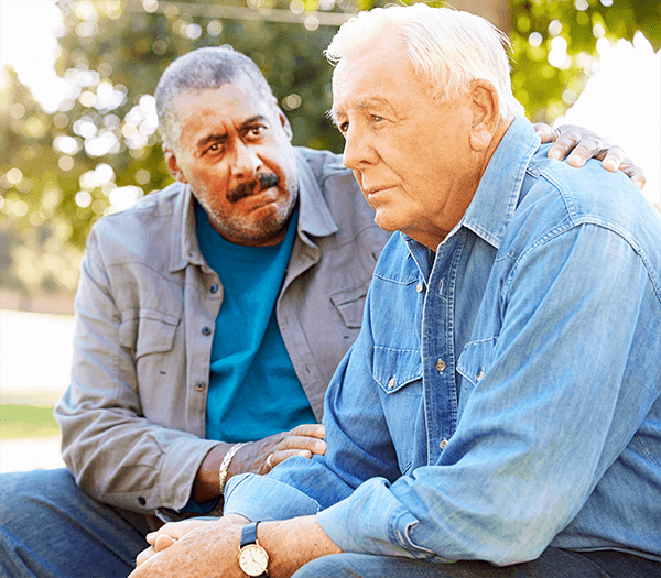 man-comforting-other-man-dementia Man comforting another man